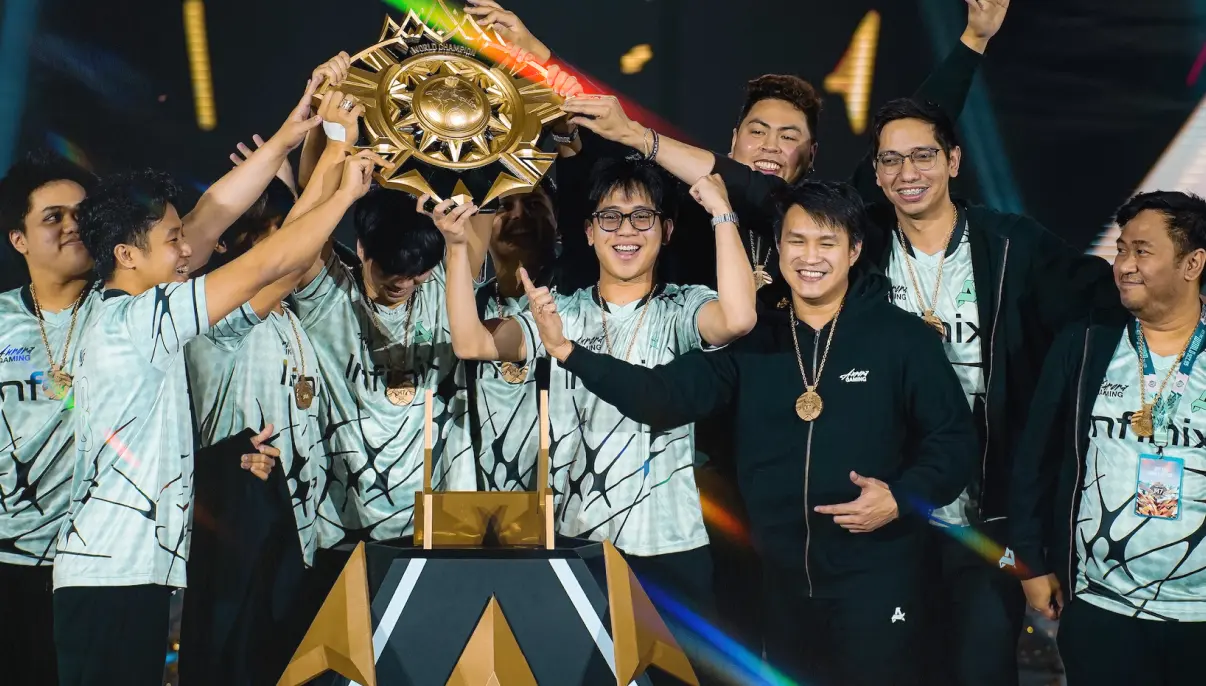 Esports players from KRU Esports in black-purple VISA jerseys smiling together on brightly lit stage